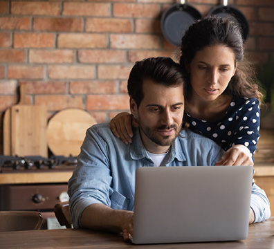 Parents looking at laptop