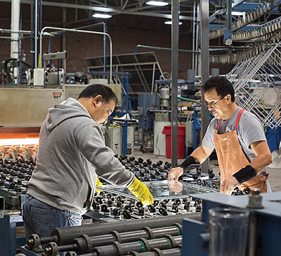 Two men working in a factory